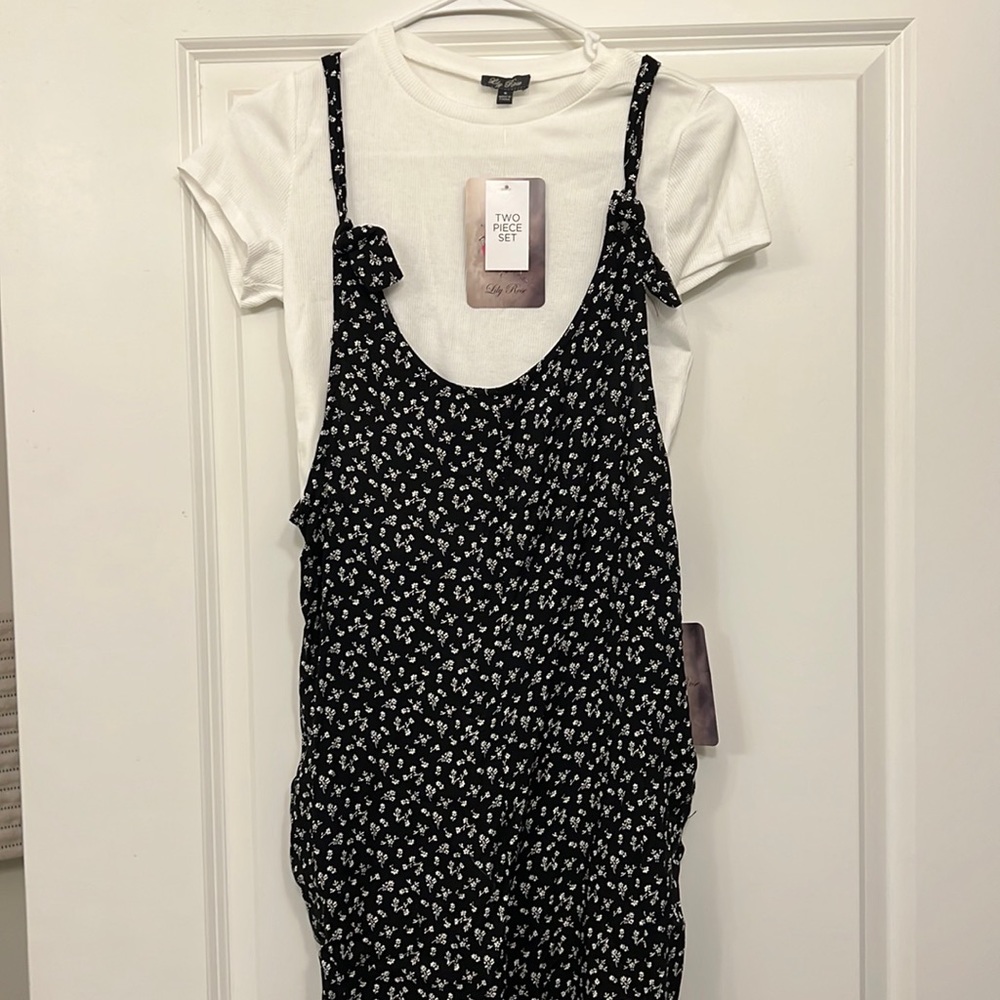 Small black and white jumper with white crop top underneath. Two piece set